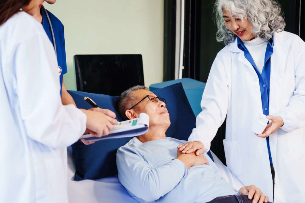 Doctor reviewing recovery progress with patient considering life insurance after a stroke diagnosis